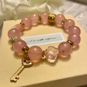Creamy Pink 12mm Quartz Bracelet with Heart Key charm gold accents